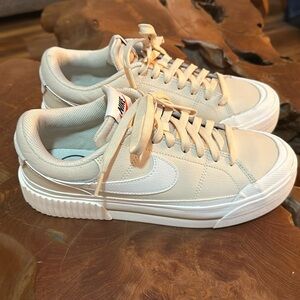 Women's Nike Sneakers. Size 7.5. Light tan and white.